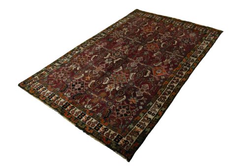 Corner detail of 2000s Shiraz rug showing border pattern and Wool pile