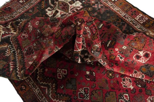 Surface texture of 2000s Shiraz rug with natural Wool and intricate pattern