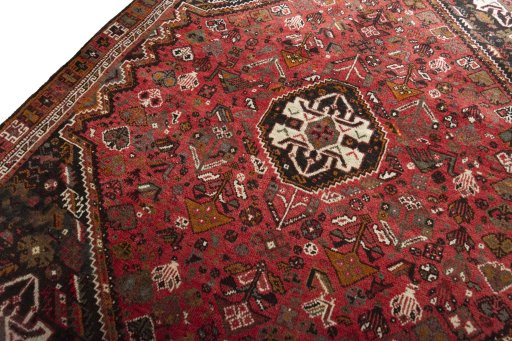 Backside of handmade 2000s Shiraz rug showing knot structure and weave density