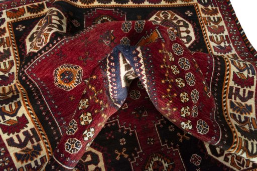 Surface texture of 2000s Shiraz rug with natural Wool and intricate pattern