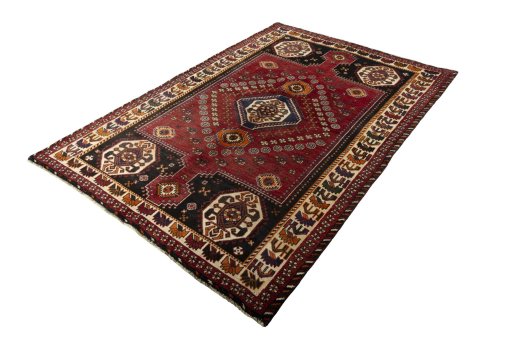 Corner detail of 2000s Shiraz rug showing border pattern and Wool pile