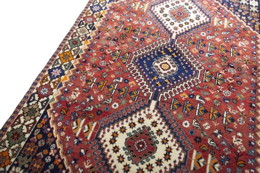 Backside of handmade 2000s Shiraz rug showing knot structure and weave density