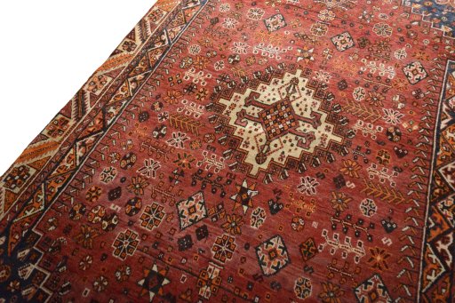 Backside of handmade 2000s Shiraz rug showing knot structure and weave density
