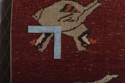 Corner detail of 2000s Shiraz rug showing border pattern and Wool pile
