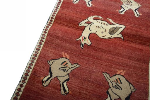 Backside of handmade 2000s Shiraz rug showing knot structure and weave density