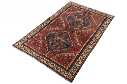 Corner detail of 2000s Shiraz rug showing border pattern and Wool pile