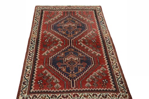 Surface texture of 2000s Shiraz rug with natural Wool and intricate pattern