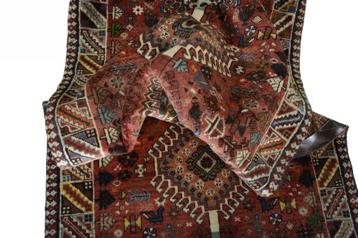 Corner detail of 2000s Shiraz rug showing border pattern and Wool pile