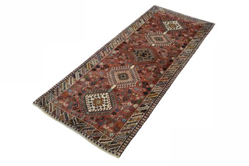 Corner detail of 2000s Shiraz rug showing border pattern and Wool pile