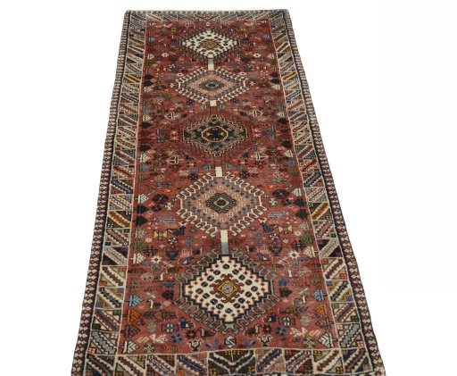 Surface texture of 2000s Shiraz rug with natural Wool and intricate pattern