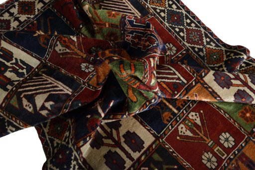 Corner detail of 2000s Shiraz rug showing border pattern and Wool pile