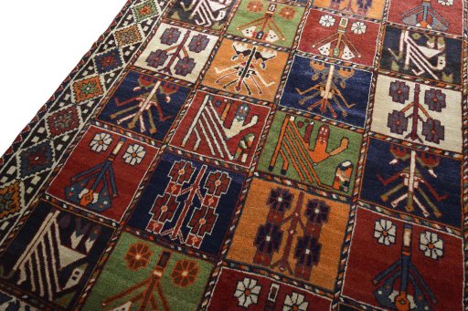 Backside of handmade 2000s Shiraz rug showing knot structure and weave density