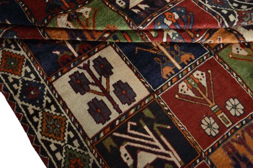 Full view of 2000s Shiraz rug from Iran / Persia, 255 × 150 cm in Multi Color tones