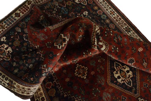 Corner detail of 2000s Shiraz rug showing border pattern and Wool pile