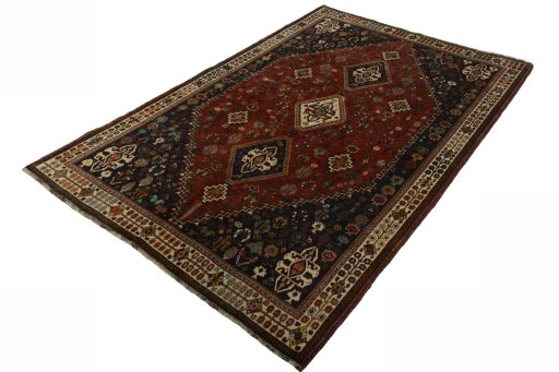 Corner detail of 2000s Shiraz rug showing border pattern and Wool pile