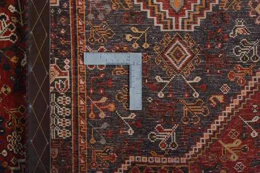 Surface texture of 2000s Shiraz rug with natural Wool and intricate pattern