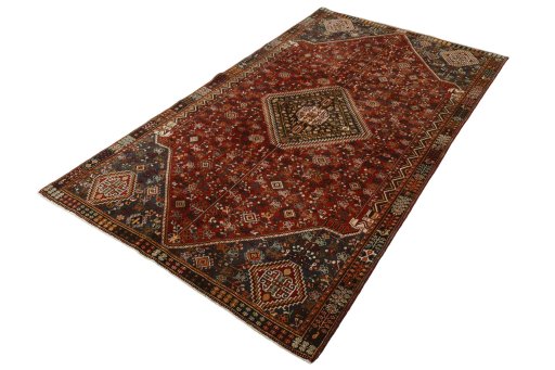 Corner detail of 2000s Shiraz rug showing border pattern and Wool pile