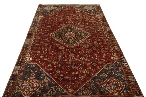 Surface texture of 2000s Shiraz rug with natural Wool and intricate pattern