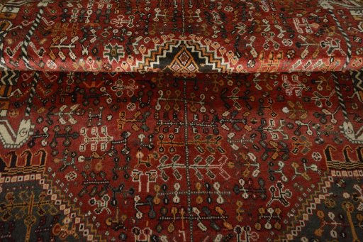 Corner detail of 2000s Shiraz rug showing border pattern and Wool pile