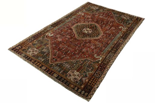 Corner detail of 2000s Shiraz rug showing border pattern and Wool pile