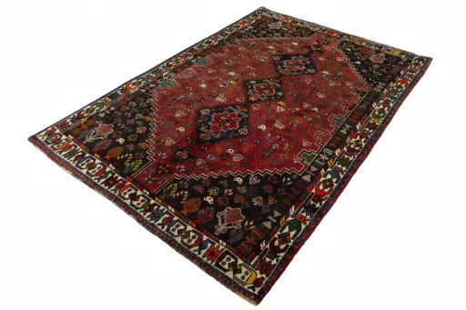 Corner detail of 1970s Shiraz rug showing border pattern and Wool pile