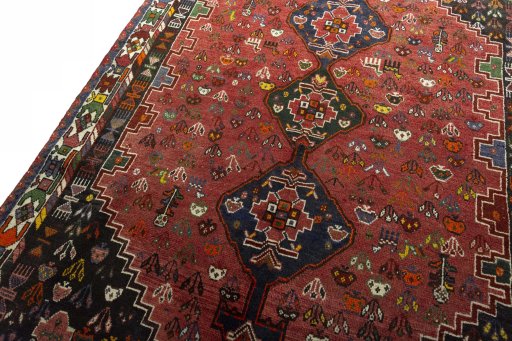 Backside of handmade 1970s Shiraz rug showing knot structure and weave density