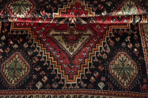 Corner detail of 1970s Shiraz rug showing border pattern and Wool pile
