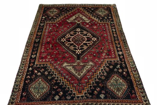 Surface texture of 1970s Shiraz rug with natural Wool and intricate pattern