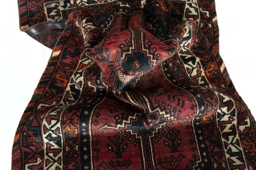 Corner detail of 2000s Shiraz rug showing border pattern and Wool pile
