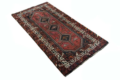 Corner detail of 2000s Shiraz rug showing border pattern and Wool pile