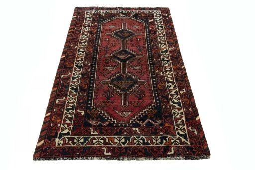 Surface texture of 2000s Shiraz rug with natural Wool and intricate pattern