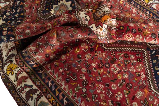 Corner detail of 2000s Shiraz rug showing border pattern and Wool pile