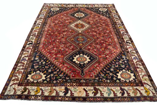 Surface texture of 2000s Shiraz rug with natural Wool and intricate pattern