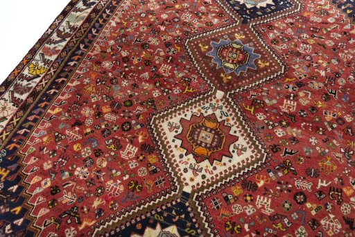 Backside of handmade 2000s Shiraz rug showing knot structure and weave density