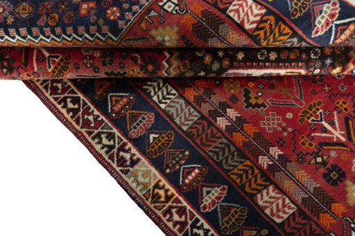 Corner detail of 2000s Shiraz rug showing border pattern and Wool pile