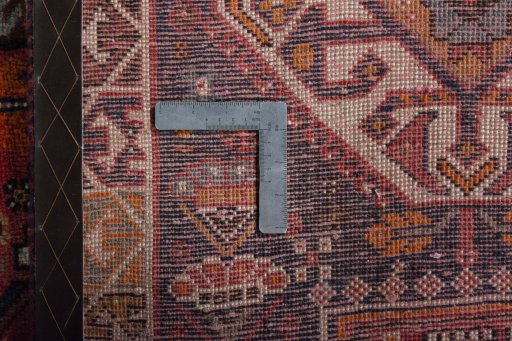 Surface texture of 2000s Shiraz rug with natural Wool and intricate pattern