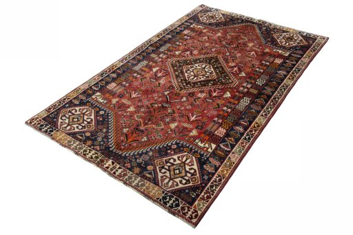 Corner detail of 2000s Shiraz rug showing border pattern and Wool pile