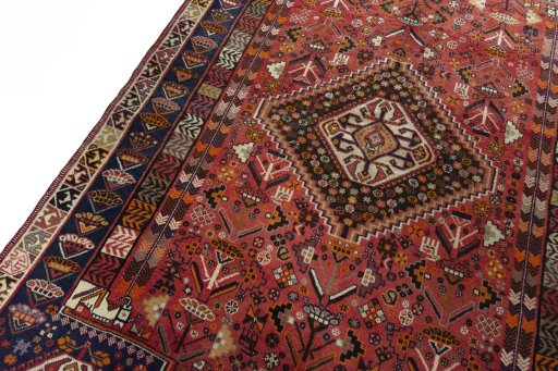 Backside of handmade 2000s Shiraz rug showing knot structure and weave density