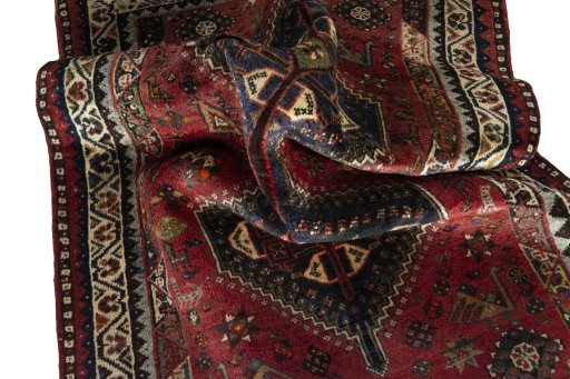 Corner detail of 2000s Shiraz rug showing border pattern and Wool pile