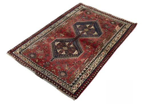 Corner detail of 2000s Shiraz rug showing border pattern and Wool pile