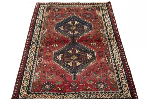 Surface texture of 2000s Shiraz rug with natural Wool and intricate pattern