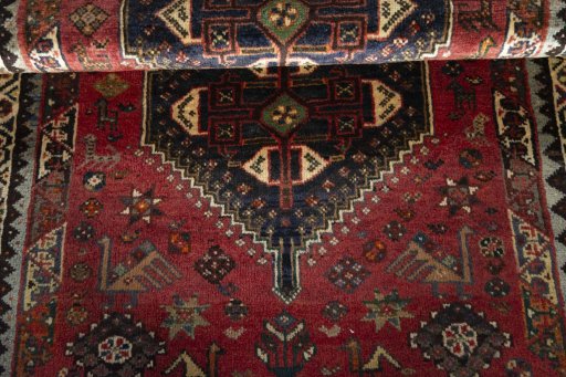 Full view of 2000s Shiraz rug from Iran / Persia, 175 × 118 cm in Red tones
