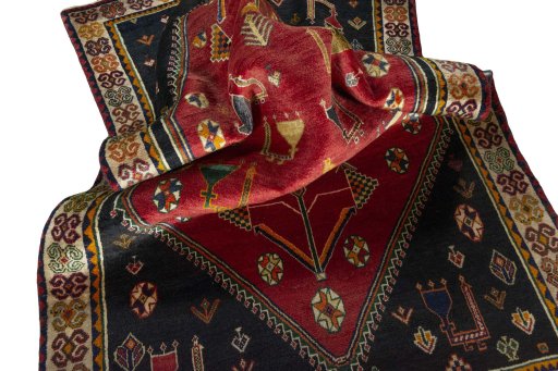 Corner detail of 2000s Shiraz rug showing border pattern and Wool pile