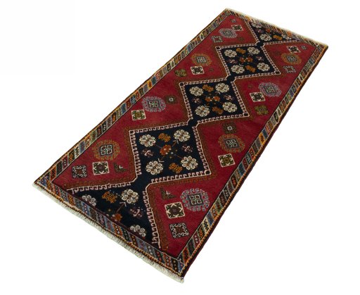 Corner detail of 2000s Shiraz rug showing border pattern and Wool pile