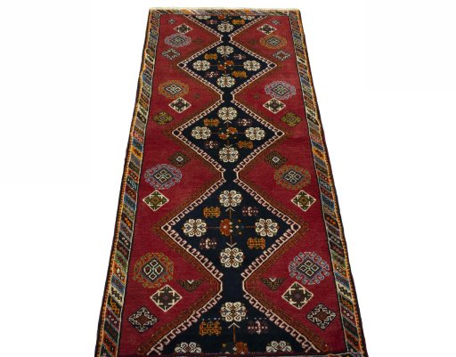 Surface texture of 2000s Shiraz rug with natural Wool and intricate pattern