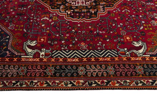Corner detail of 2000s Shiraz rug showing border pattern and Wool pile