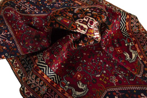 Surface texture of 2000s Shiraz rug with natural Wool and intricate pattern