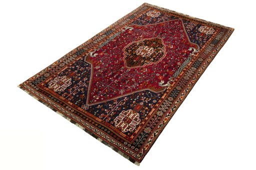 Corner detail of 2000s Shiraz rug showing border pattern and Wool pile