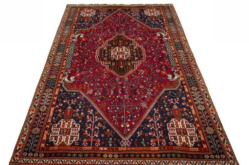 Surface texture of 2000s Shiraz rug with natural Wool and intricate pattern