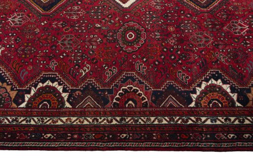 Corner detail of 2000s Shiraz rug showing border pattern and Wool pile